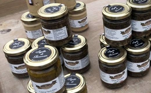 Jars of truffle cream and truffle sauce