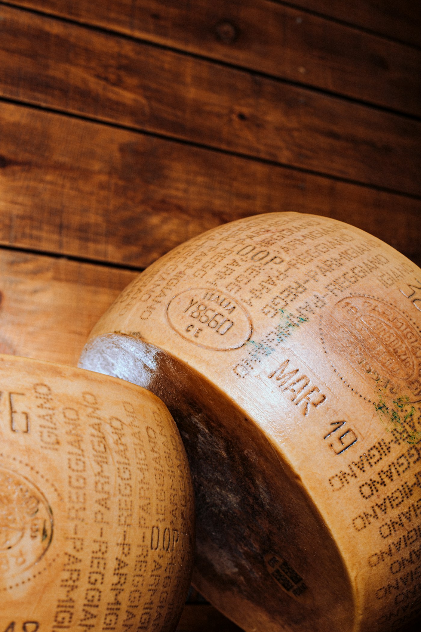 A wheel of Parmigiano Reggiano with its branded rind