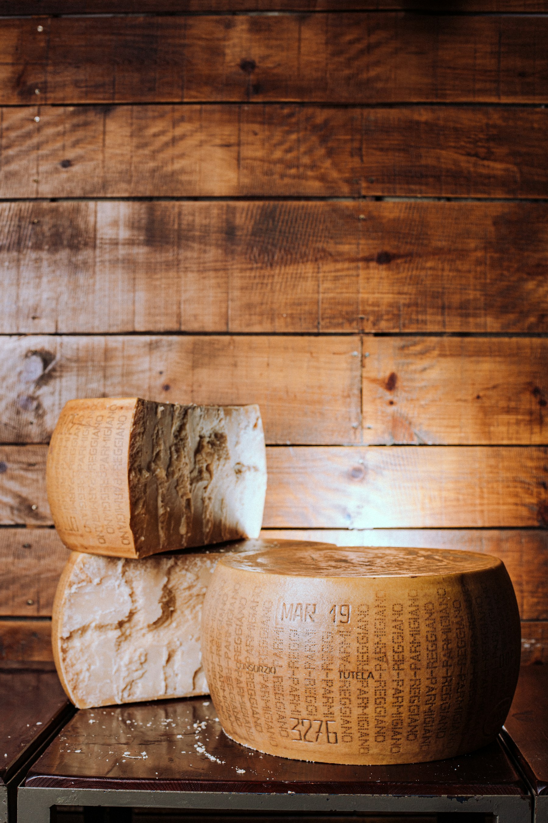 Aged wheels of Parmigiano Reggiano
