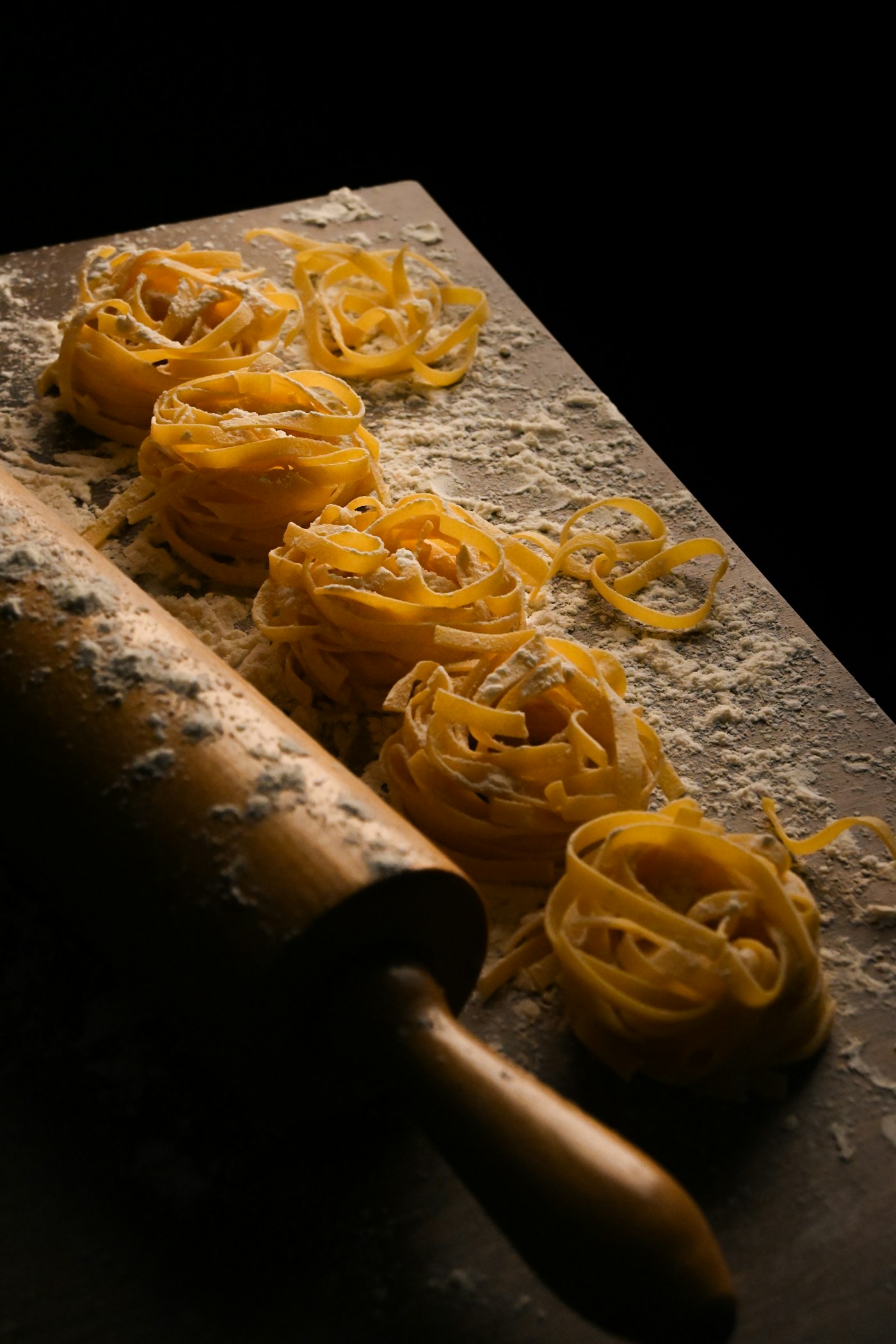 Fresh egg pasta nests dusted with flour